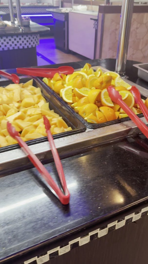 Sushi bar with neatly arranged rolls and platters.